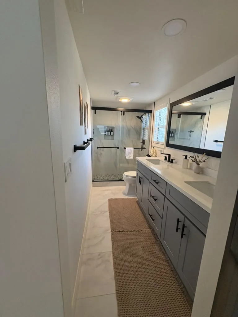 Marble shower and double vanity after a deep clean
