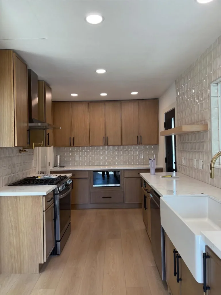 Wood cabinet kitchen with a farmhouse sink after a deep clean