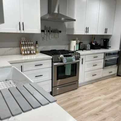 Oven, range and white cabinets after a deep clean